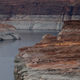 A boat navigates the waters Lake Powell on June 24, 2021 in Page, Arizona. As severe drought grips parts of the Western United States, a below average flow of water is expected to flow through the Colorado River Basin into two of its biggest reservoirs, Lake Powell and Lake Mead.